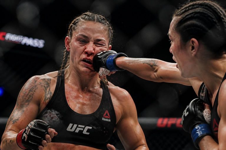 mma fighter discusses the passion and dedication behind the sport, emphasizing the importance of perseverance despite taking hits in the ring.