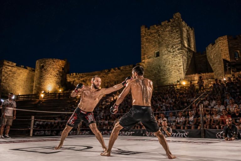 experience an exhilarating martial arts fight night at the historic puivert castle, blending thrilling combat with a stunning medieval backdrop.